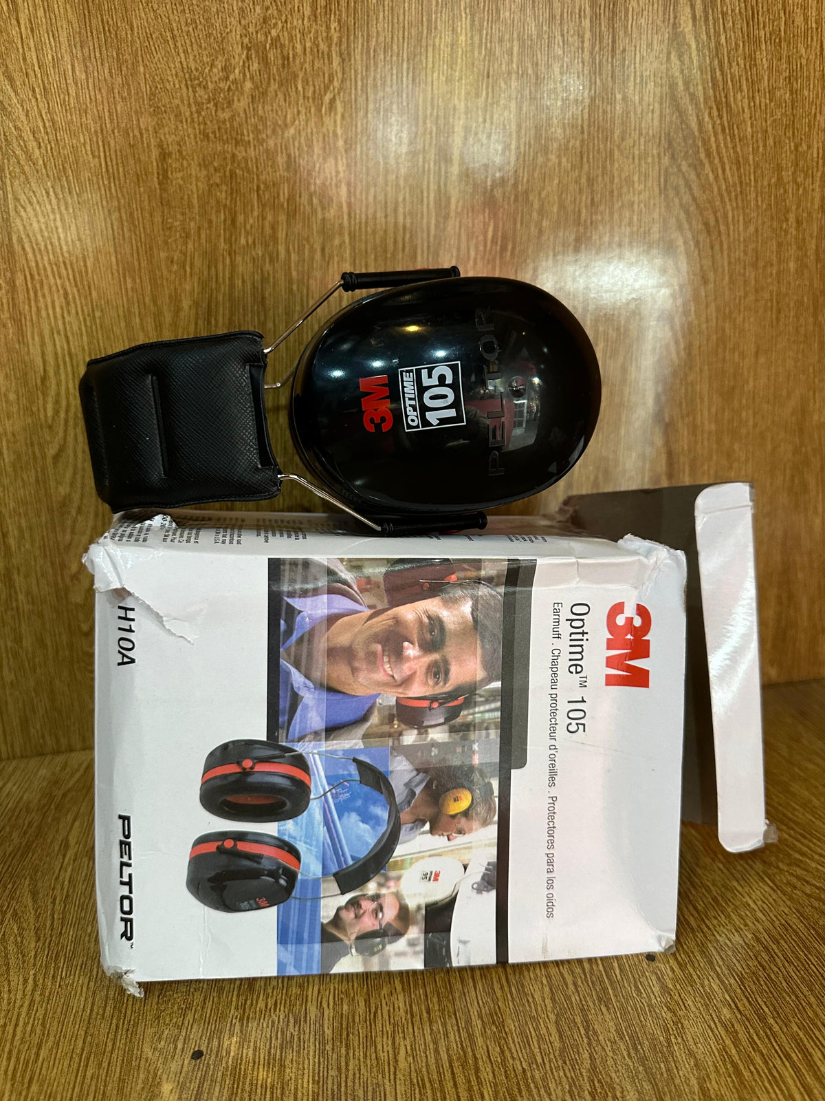 3M Peltor Optime 105 Over-the-Head Earmuffs (Model H10A), designed for hearing protection in extremely loud environments.