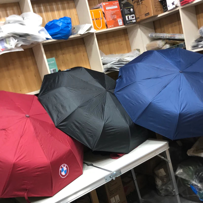 Three umbrellas red, black, blue 