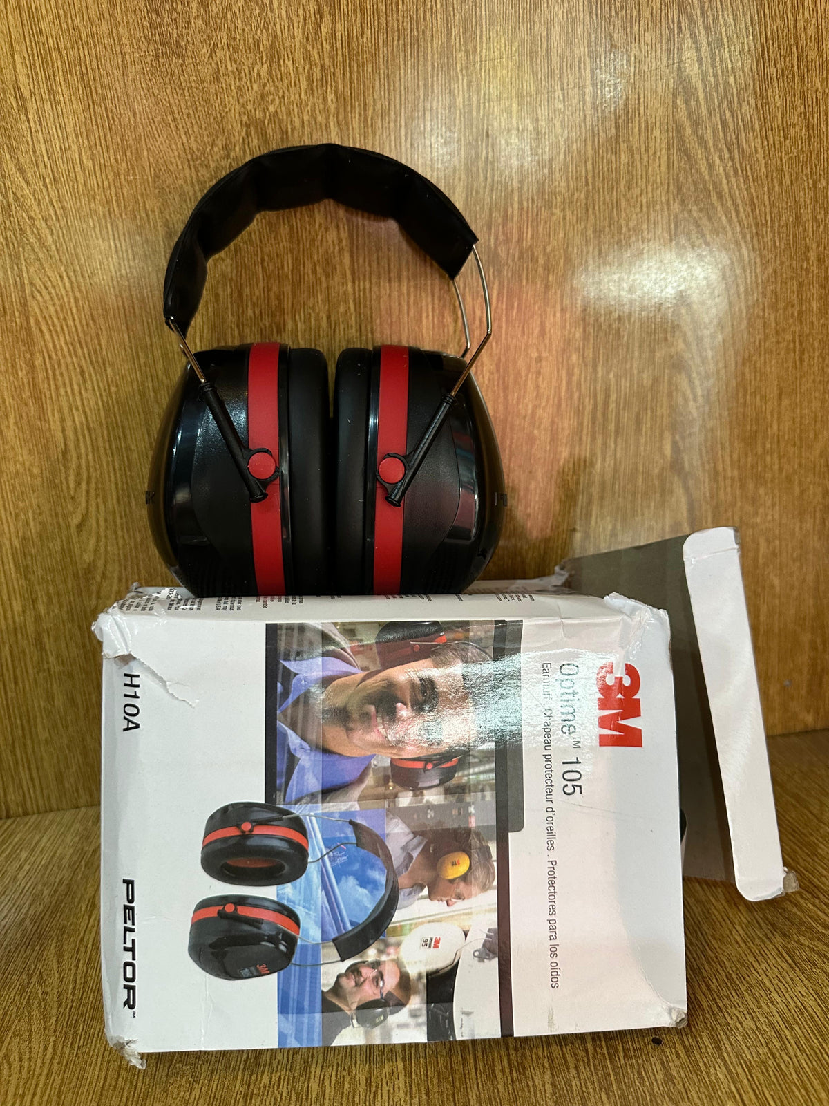 3M Peltor Optime 105 Over-the-Head Earmuffs (Model H10A), designed for hearing protection in extremely loud environments.