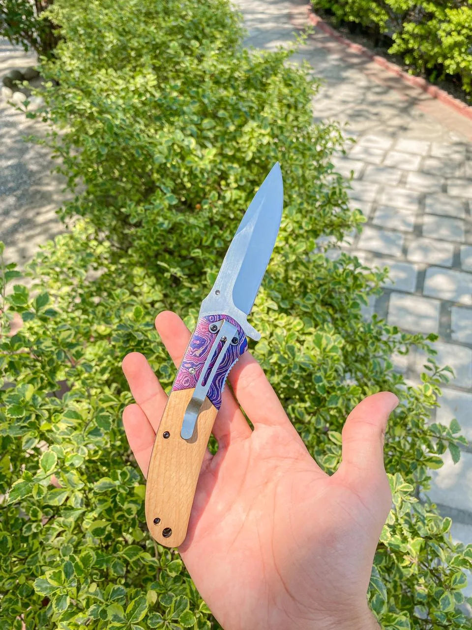 "Compact folding tool for outdoor activities and camping tasks"
