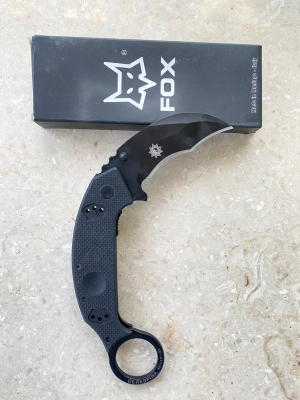 "Durable multi-use tool in black for hiking, camping, and emergency preparedness"