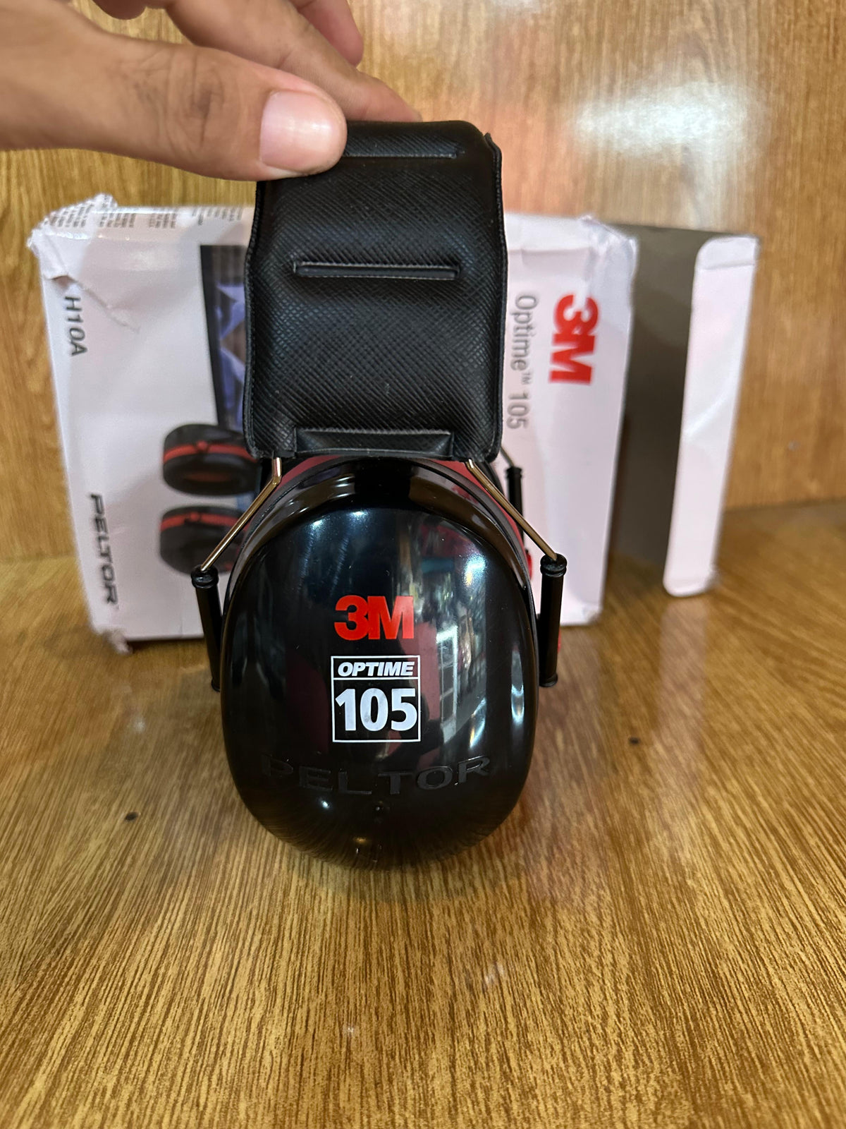 3M Peltor Optime 105 Over-the-Head Earmuffs (Model H10A), designed for hearing protection in extremely loud environments.
