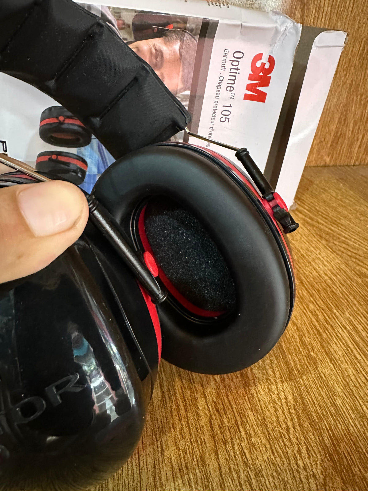 3M Peltor Optime 105 Over-the-Head Earmuffs (Model H10A), designed for hearing protection in extremely loud environments.
