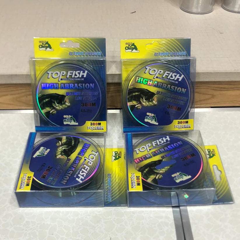 Top Fish high abrasion fishing line in packaging on a white surface