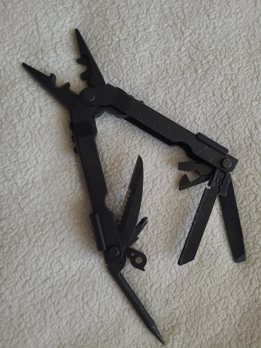 Gerber Multi-Plier 600, multi-tool pliers, portable multitool, camping multitool, survival multitool, outdoor multitool, DIY tool, multi-tool with pliers, professional multitool, black Gerber multitool, stainless steel multitool
