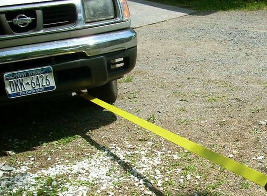 "High-strength green recovery strap for towing and lifting heavy loads"