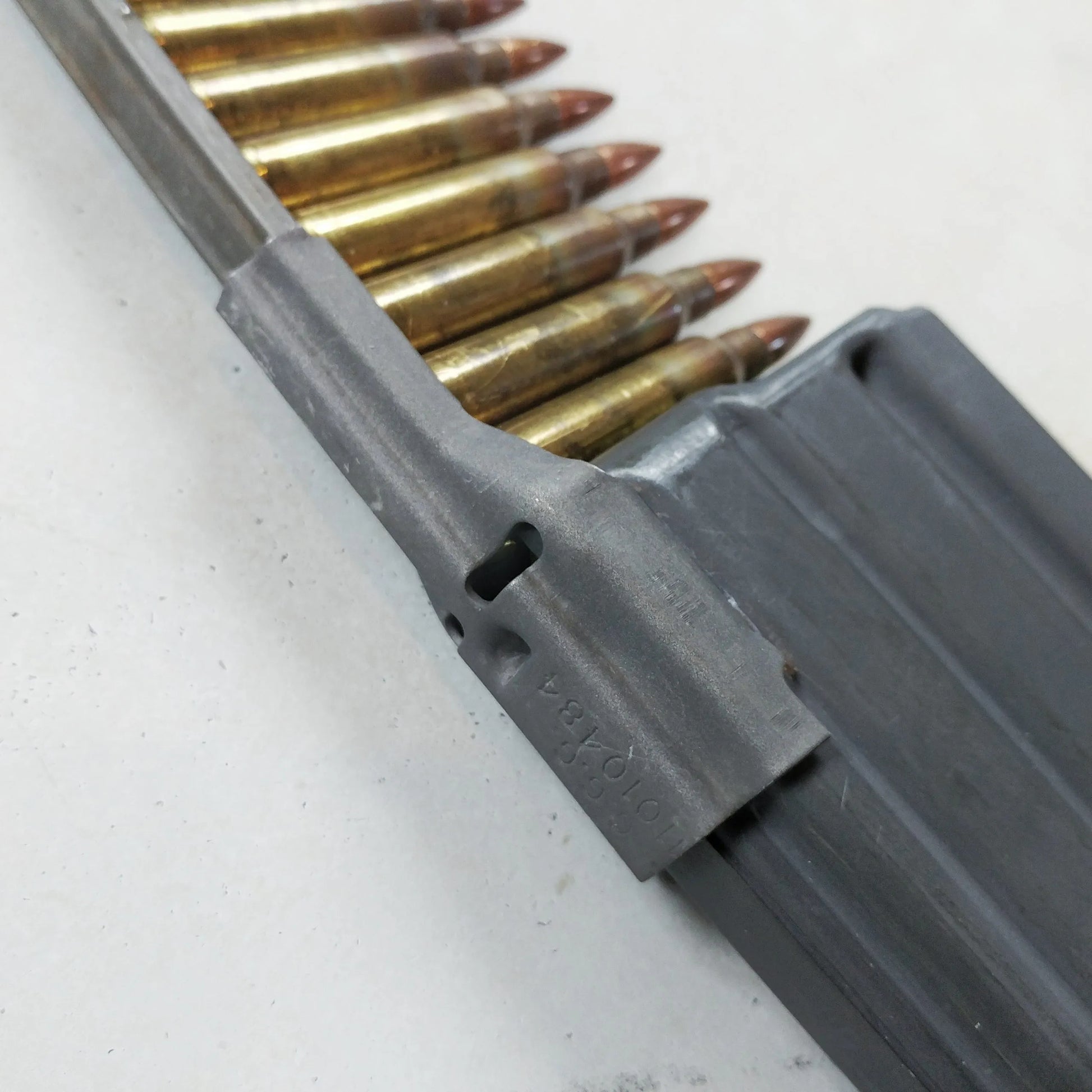 M4 quick loader, M16 quick loader, stripper clip spoon, surplus ammo loader, military surplus loader, magazine loader, fast reload tool, M4 magazine loader, M16 magazine loader, tactical reload tool, shooting accessories Pakistan, military gear Pakistan, ammo loading spoon, lightweight reload tool, compact loader
