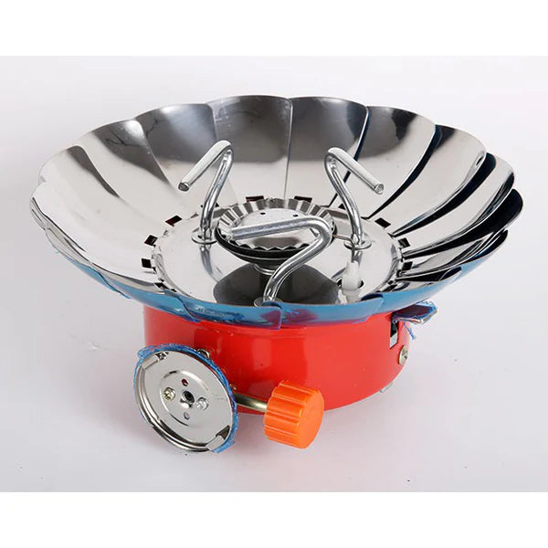 Portable camping stove with red base and silver top 