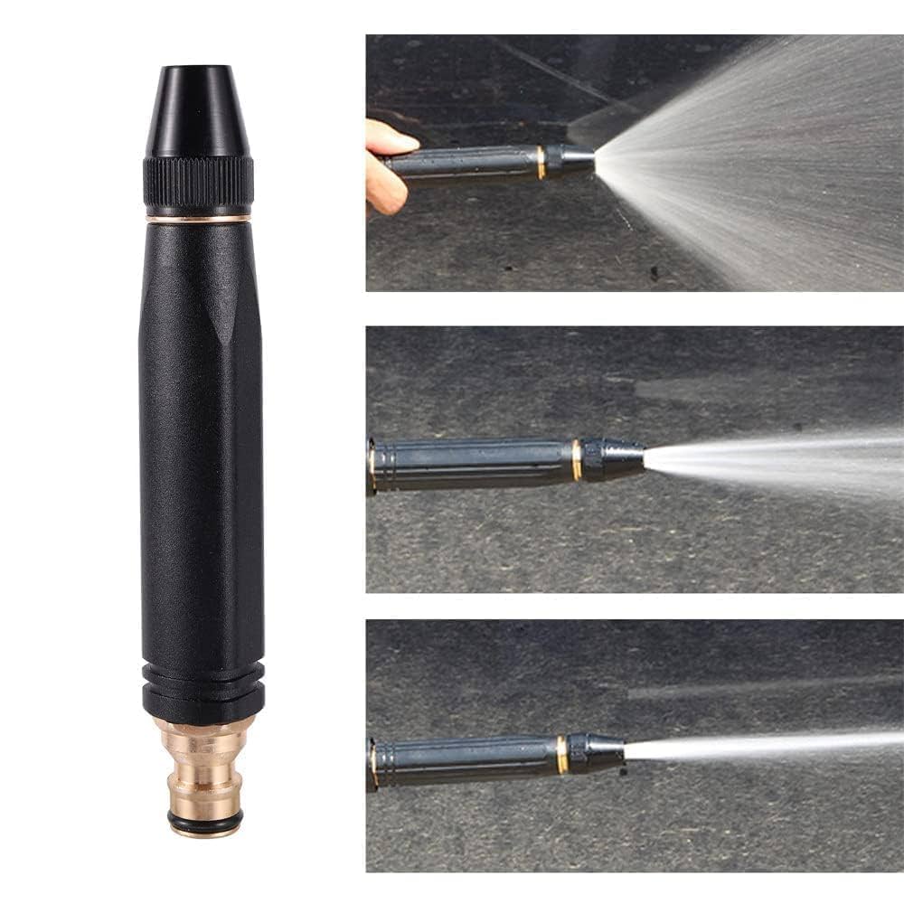 Black and gold spray nozzle with water spraying onto a surface attachment
